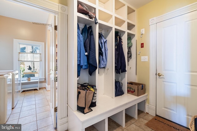 11520 Magnolia Ct, Issue, MD 20645 - mudroom with washer and clothes dryer and light tile patterned floors