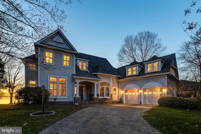 11520 Magnolia Ct, Issue, MD 20645 - view of front of house featuring decorative driveway, a yard, and a garage