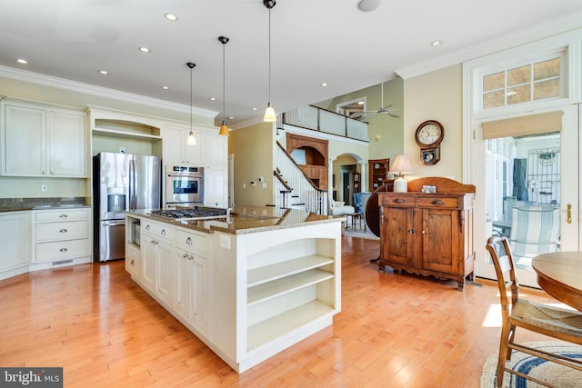 11520 Magnolia Ct, Issue, MD 20645 - kitchen with open shelves, appliances with stainless steel finishes, ornamental molding, pendant lighting, and a center island