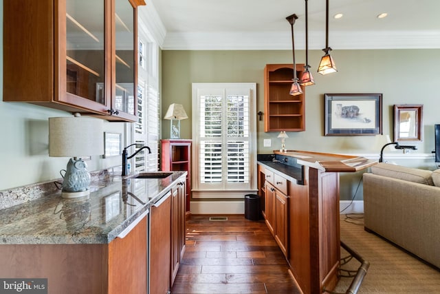 11520 Magnolia Ct, Issue, MD 20645 - kitchen featuring a sink, brown cabinetry, dark wood finished floors, glass insert cabinets, and crown molding
