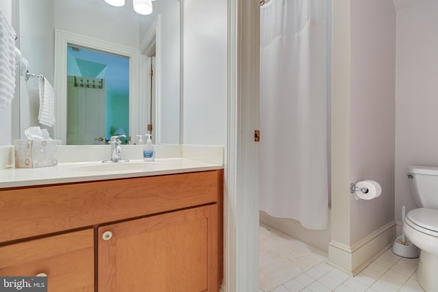 11520 Magnolia Ct, Issue, MD 20645 - bathroom featuring toilet, vanity, tile patterned flooring, curtained shower, and baseboards