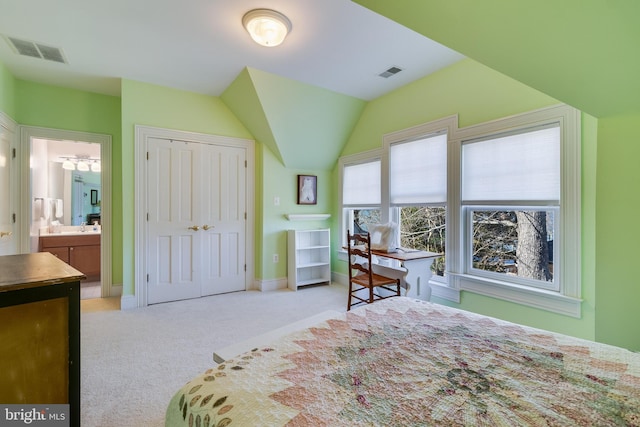 11520 Magnolia Ct, Issue, MD 20645 - bedroom with light carpet, connected bathroom, a closet, baseboards, and vaulted ceiling