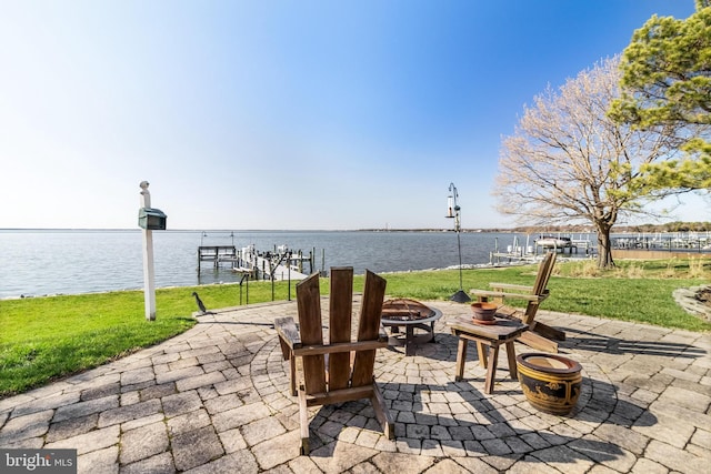 11520 Magnolia Ct, Issue, MD 20645 - view of patio with a fire pit, a water view, and a boat dock