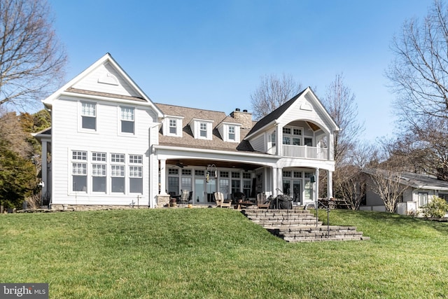 11520 Magnolia Ct, Issue, MD 20645 - rear view of house with a balcony, a yard, ceiling fan, and a chimney
