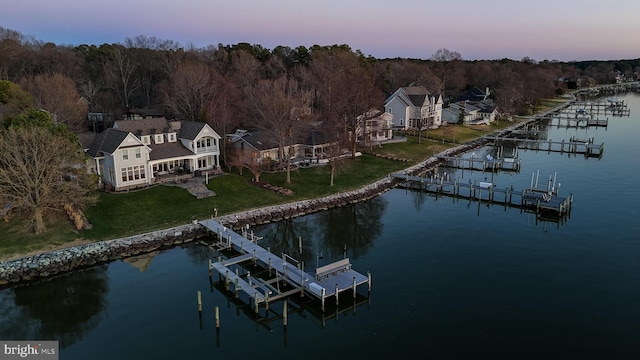 11520 Magnolia Ct, Issue, MD 20645 - dock featuring boat lift, a water view, a lawn, and a forest view