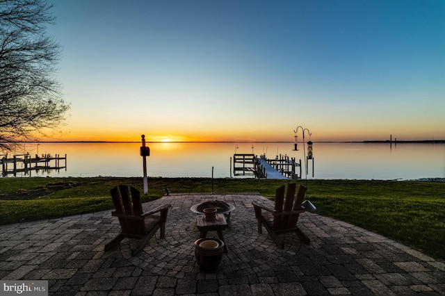 11520 Magnolia Ct, Issue, MD 20645 - patio terrace at dusk featuring a water view, a patio, and a fire pit