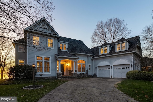 11520 Magnolia Ct, Issue, MD 20645 - shingle-style home with asphalt driveway, a front yard, an attached garage, and a shingled roof