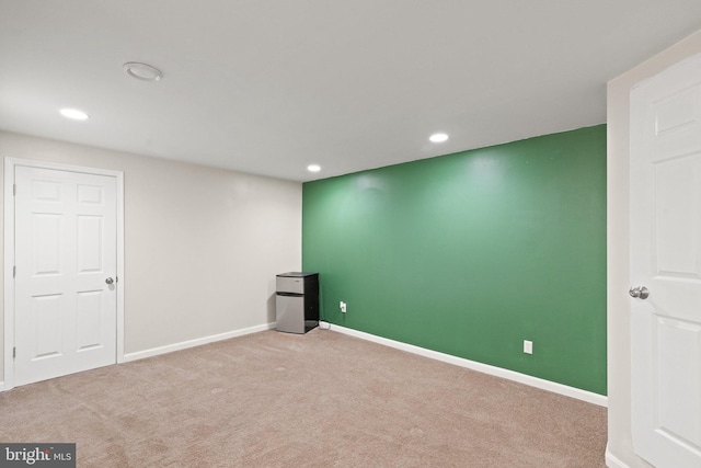 basement featuring recessed lighting, baseboards, and carpet floors