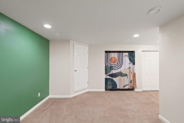 empty room with recessed lighting, baseboards, and carpet floors