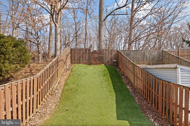 view of yard featuring a fenced backyard