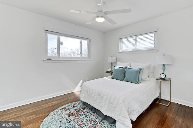 bedroom with wood finished floors, baseboards, and ceiling fan