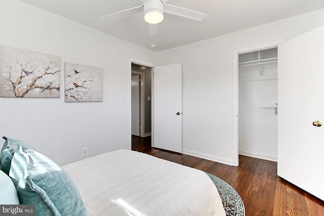 bedroom with a ceiling fan, wood finished floors, and a closet