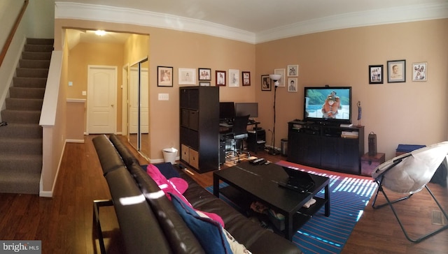 living room featuring crown molding, stairway, wood finished floors, and baseboards