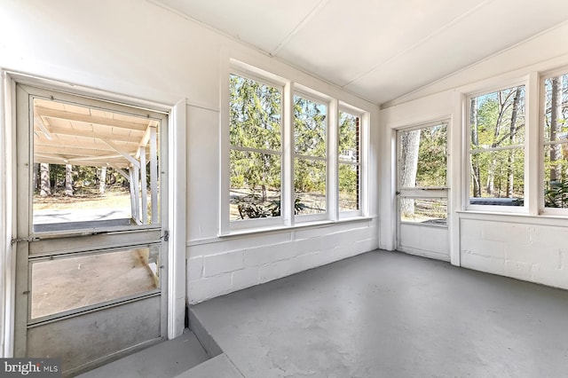 unfurnished sunroom with lofted ceiling