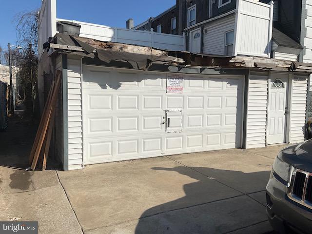 garage featuring driveway