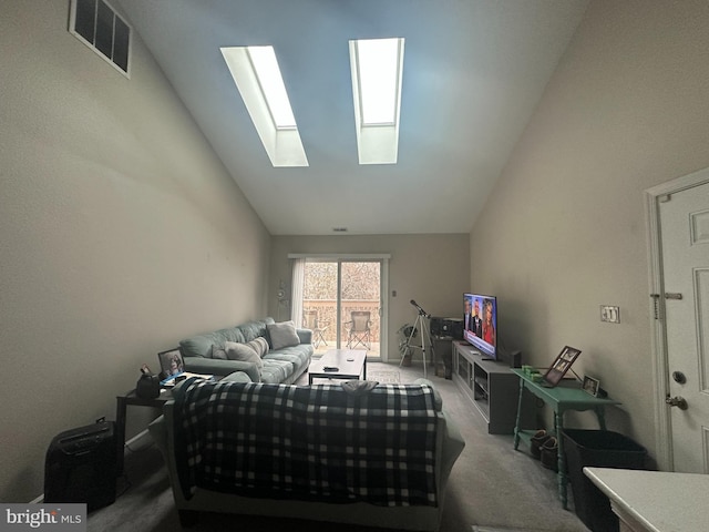 bedroom featuring visible vents, carpet floors, and lofted ceiling with skylight