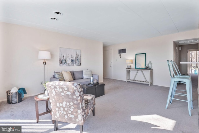 carpeted living room with visible vents