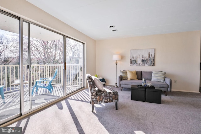 living room with baseboards and carpet floors