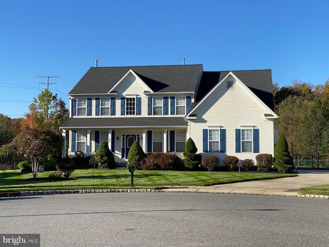 view of front of property with a front lawn