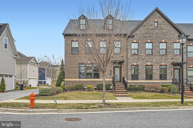 view of front of home with brick siding