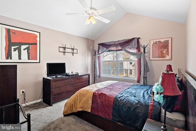 carpeted bedroom with a ceiling fan, baseboards, and vaulted ceiling