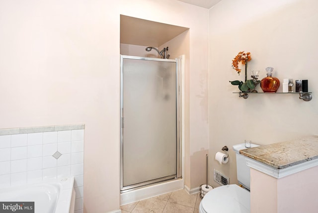 full bathroom with tile patterned flooring, toilet, a bath, and a stall shower