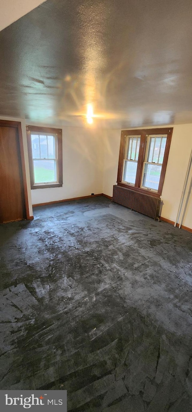 15941 Foundry Row NW, Mount Savage, MD 21545 - empty room featuring radiator and plenty of natural light