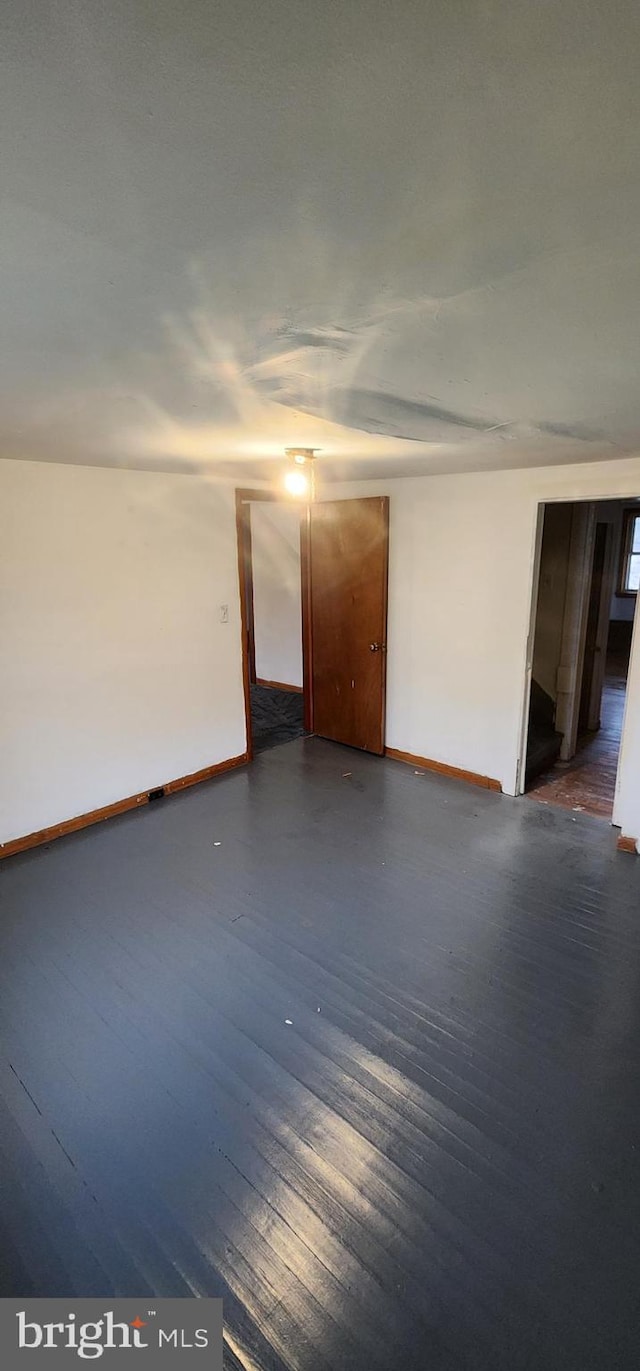 15941 Foundry Row NW, Mount Savage, MD 21545 - unfurnished room featuring baseboards and dark wood finished floors