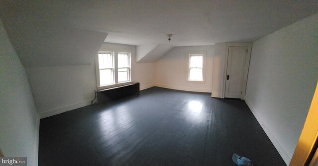 15941 Foundry Row NW, Mount Savage, MD 21545 - bonus room with plenty of natural light, dark wood-style flooring, radiator heating unit, and vaulted ceiling