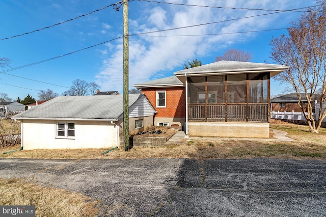 view of front of property with a sunroom