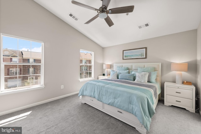 carpeted bedroom with visible vents, vaulted ceiling, and multiple windows
