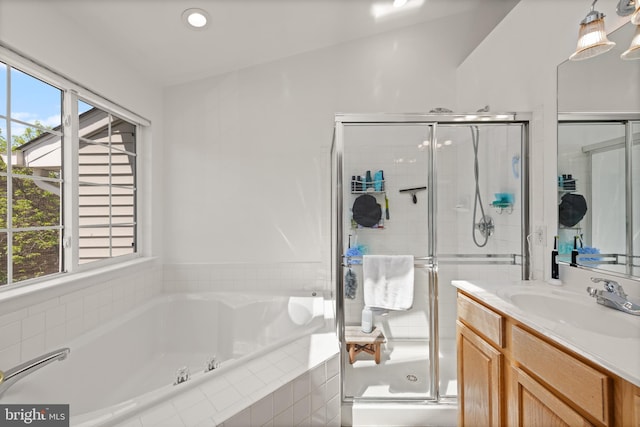 full bathroom with vanity, a shower stall, recessed lighting, and a garden tub