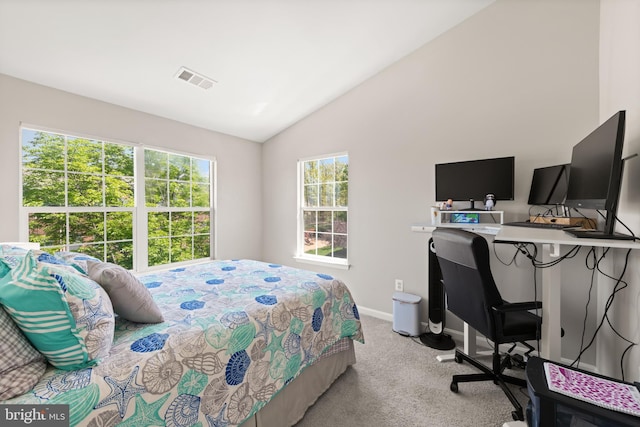 bedroom featuring baseboards, visible vents, light colored carpet, and lofted ceiling