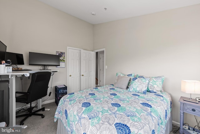 bedroom featuring baseboards and carpet