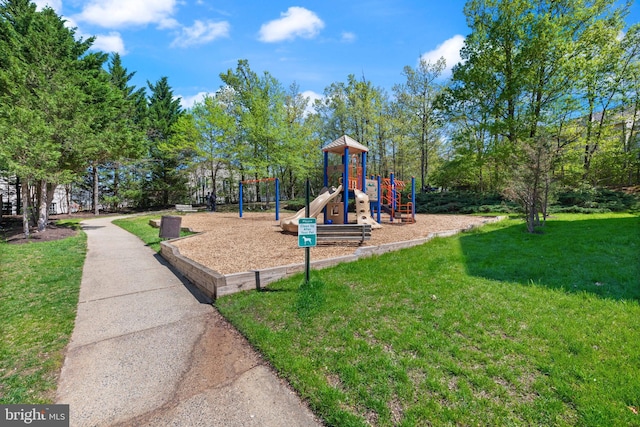 community playground featuring a lawn