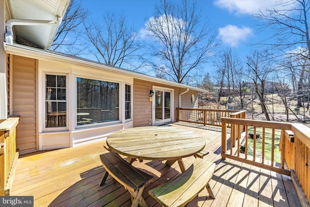 deck featuring outdoor dining area