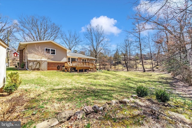 view of yard featuring a wooden deck