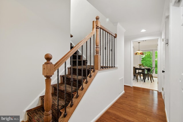 11807 Bare Sky Ln, Columbia, MD 21044 - stairs with crown molding, recessed lighting, baseboards, and wood finished floors