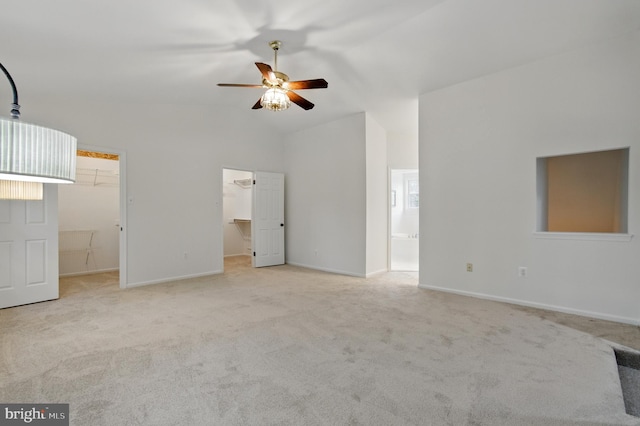 11807 Bare Sky Ln, Columbia, MD 21044 - unfurnished living room with carpet floors, ceiling fan, vaulted ceiling, and baseboards
