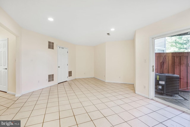 empty room with recessed lighting, visible vents, baseboards, and light tile patterned flooring