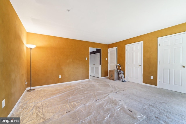 unfurnished bedroom with baseboards