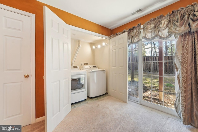 laundry area featuring visible vents, carpet, laundry area, and washing machine and clothes dryer