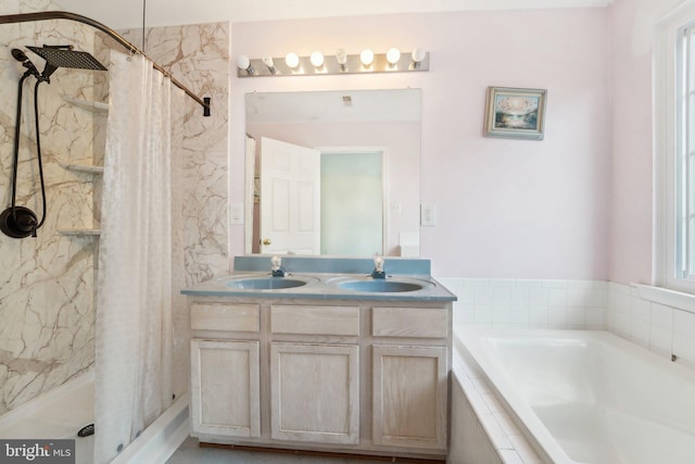 full bathroom featuring a sink, a garden tub, and a stall shower