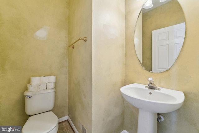 bathroom with visible vents and toilet