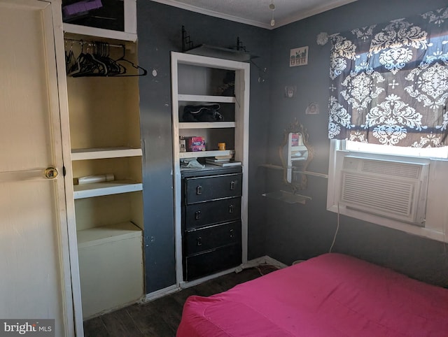 bedroom with dark wood finished floors and cooling unit