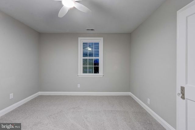 spare room featuring visible vents, baseboards, and carpet floors