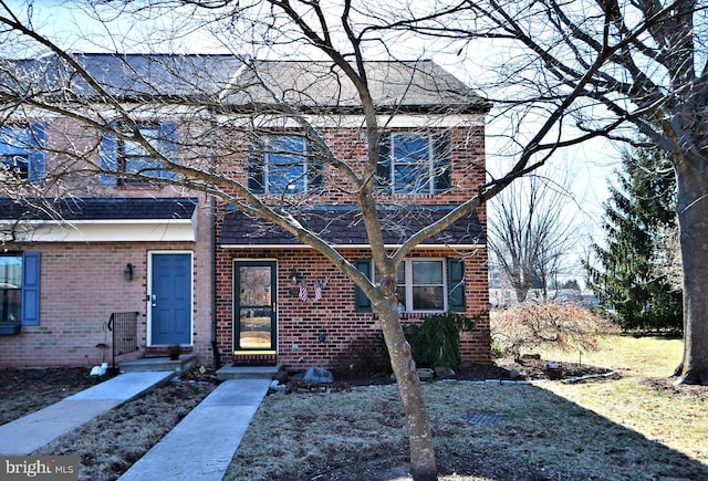 view of front of home with brick siding