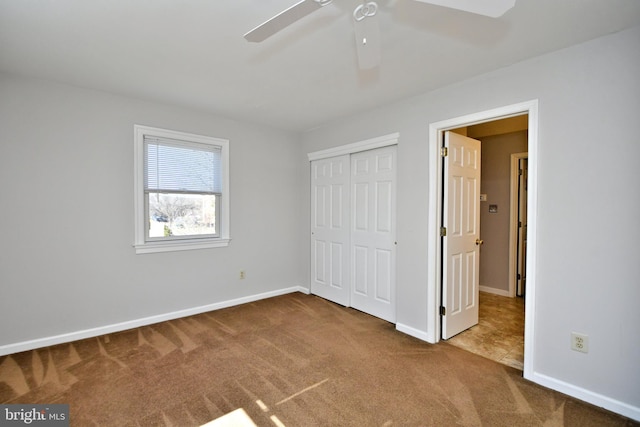 unfurnished bedroom featuring a closet, baseboards, carpet, and a ceiling fan