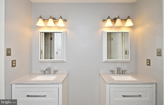 bathroom with two vanities and a sink