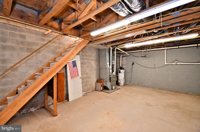 unfinished basement with stairs, heating unit, and water heater